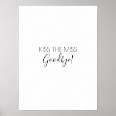 a white card with the words kiss the miss goodbye on it and a vase filled with flowers