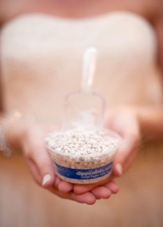 a person holding a container with food in it