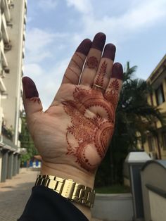 a person's hand with henna on it