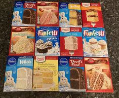 twelve boxes of frosted cake mixes are on the counter