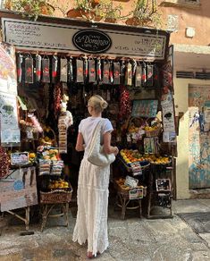 a woman standing in front of a store