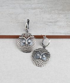 Wise Owl Dangle Drop Earrings 925 Sterling Silver with Clear Cubic Zirconia CZ Gemstones Artisan Crafted Vintage Inspired Material: 925 Sterling Silver Clear Cubic Zirconia CZ Gemstones Earrings Length: 1.60 inches Width: 0.90 inches Closure: Lever back Matching pendant is available https://www.etsy.com/listing/1027110377/wise-owl-pendant-necklace-925-sterling?ref=listings_manager_grid Comes with a gift pouch and box Free Domestic Shipping It is a gift that will create memories for years to come Silver Cubic Zirconia Pendant Earrings, Nickel Free Sterling Silver Clip-on Earrings, Gift Silver Nickel Free Clip-on Earrings, Nickel-free Silver Clip-on Earrings, Sterling Silver Drop Clip-on Earrings For Gift, Sterling Silver Drop Clip-on Earrings As Gift, Gift Earrings With Oxidized Metal Finish, Metal Earrings With Oxidized Finish For Gift, Adjustable Sterling Silver Clip-on Earrings