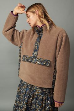 It's time to get cozy, and this relaxed-fit reversible pullover is the perfect place to start. It's like two jackets in one, designed with plush sherpa fleece on one side and a groovy floral-print woven on the other. Snap buttons fasten the half placket, and adjustable bungees draw in the hem for a personalized fit that keeps the cold out. •Reversible •Stand collar •Half placket with snap closures •Zip front on floral print side •Front kangaroo pocket •Contrast panel at sides •Adjustable bungees Teddy Bear Jacket, Coat Trends, Sherpa Hoodie, Teddy Jacket, Sherpa Jacket, Sherpa Fleece, Getting Cozy, Faux Fur Jacket, Puffer Coat