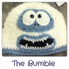 a crocheted hat with eyes and mouth