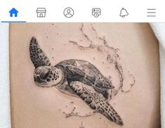 a tattoo with a turtle on it's stomach