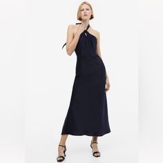 Sleeveless, Ankle-Length Halterneck Dress In Softly Draped Satin. Narrow Cut At Top With Crossover Front For A Draped Affect At Bust And Wide Ties At Back Of Neck. Concealed Zipper At Back With A Hook-And-Eye Fastener. Seam At Waist And Gently Flared Skirt. Unlined. Chic Sleeveless Halter Neck Dress With Tie Back, Sleeveless Tie Back Dress For Date Night, Sleeveless Dress With Tie Back For Date Night, Sleeveless Tie Back Halter Dress For Cocktail, Sleeveless Tie Back Halter Dress For Night Out, Elegant Halter Neck Maxi Dress For Casual Occasions, Chic Sleeveless Slip Dress For Casual Occasions, Sleeveless Tie-back Maxi Dress For Night Out, Chic Sleeveless Midi Dress With Tie Back