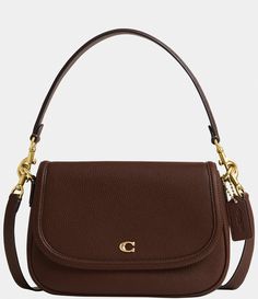 From COACH&#x2C; the Legacy Small Pebbled Leather Shoulder Bag features: Featuring a COACH logo flap&#x2C; this Legacy shoulder bag sits just beneath the underarm with the shorter strap or it can be worn as a crossbody. Small sized bag; 10"W x 7-.25"H x 2-.75"D (width is measured across the bottom of handbag); 1.32 lbs. approx. weightApprox. 7-.5" L removable short strap; 21-.5" L r Small Brown Shoulder Bag, Purse Capsule Wardrobe, Classic Coach Bags, Coach Small Purse, Brown Coach Shoulder Bag, Mid Range Luxury Bags, Everyday Designer Handbags, Coach Legacy Bag, Lo And Sons Pearl