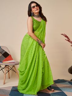 Elevate your ethnic wardrobe with our stunning bewitching green sequins georgette mehendi wear saree with blouse. This beautiful saree is crafted from high-quality georgette material, ensuring a comfortable and elegant drape. The green color is perfectly complemented by the intricate thread embroidery and sequin work, giving it a festive and glamorous look.
This saree comes with a matching art silk blouse material, also embellished with thread embroidery and sequin work. The 5.50 meters saree an Green Pre-draped Saree With Mirror Work For Festivals, Green Chinon Sharara For Party Wear, Fitted Green Pre-draped Saree With Mirror Work, Green Chinon Pre-draped Saree For Navratri, Green Pre-draped Saree With Self Design For Diwali, Green Pre-draped Saree For Eid Party, Fitted Green Chinon Saree, Green Pre-draped Saree With Mirror Work, Green Sequined Traditional Wear For Navratri