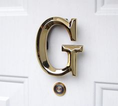 the letter g is hanging on the door