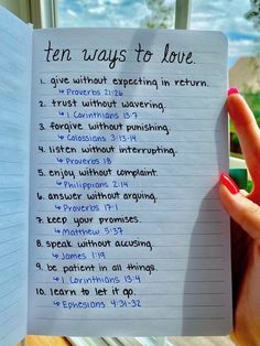 someone is holding up a notebook with the words ten ways to love written on it