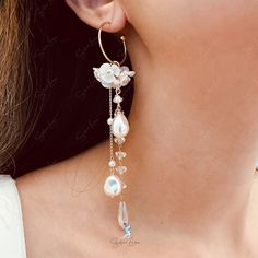 These long tassel dangle drop earrings features pearl like white flower and a long trail of artificial pearls and crystal drop earrings. These earrings make a big picture but light weight to wear, perfect wedding party earrings, bridal earrings, fashion earrings that can pair with your outfit to complete your fashion look. Materials: artificial pearls, resin, alloy, crystalFinish: gold color Jewelry Care: See more information about how to care for your jewelry here. Shipping Policy: Orders will Tassel Drop Earrings For Wedding, White Tassel Drop Earrings For Wedding, Wedding Tassel Earrings, Party Tassel Pearl Drop Earrings, Party Tassel Drop Earrings With Pearl Detail, White Tassel Earrings For Weddings, Pearl Drop Dangle Tassel Earrings For Wedding, White Dangle Tassel Earrings With Pearl Drop, White Pearl Drop Dangle Tassel Earrings