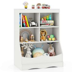 a white book shelf filled with lots of toys