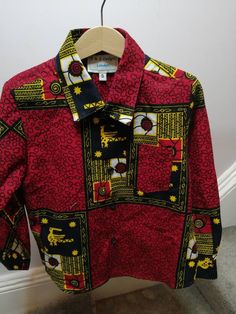 Long sleeve Boys formal shirt in an African Ankara Christmas print. Available from sizes 6 months to 6 years. Festive Patterned Long Sleeve Sets, Printed Long Sleeve Shirt For Party, Holiday Festive Long Sleeve Shirt, Red Long Sleeve Top For Gifts, Holiday Long Sleeve Shirt With Graphic Print, Cotton Long Sleeve Sets For Birthday, Long Sleeve Cotton Set For Birthday, Graphic Print Long Sleeve Shirt As Gift, Red Long Sleeve Holiday Shirt