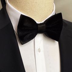 With this rich look, Smoked Velvet Bowtie takes your elegance one step further.. Dimensions: 6 cm * 12 cm Bowtie Reference, Elegant Black Velvet Tuxedo, Classic Black Bow Tie For Groom, Formal Ribbon Bow Tie, Luxury Black Suit And Tie Accessories For Groom, Luxury Black Suit And Tie Accessories For Wedding, Classic Black Ribbon Bow Tie For Wedding, Black Bow Tie For Groom, Black Tie Event Ribbon Ties