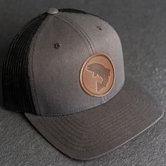 Wear your new Leather Patch Trucker Style Hat out fishing or anywhere! All hats ship for free within the USA! SPECS *Leather Patch Color Options: Natural Dublin, Nut Brown Dublin, or Cafe Chromexcel *Hat Color Options: Choose from Navy/White, Charcoal, or Green/Khaki *All of our products are made to order by hand in McKinney, TX MATERIALS *REAL HORWEEN LEATHER: Premium Full-Grain Leather. oEach patch is one-of-a-kind and made from part of a whole hide of leather. There will be unique variation f Adjustable Curved Brim Baseball Cap For Fishing, Adjustable Fishing Hat With Curved Brim, Durable Fishing Hat With Curved Brim, Durable Curved Brim Hat For Fishing, Curved Brim Trucker Hat For Fishing, Leather Baseball Cap With Short Brim For Outdoor, Leather Short Brim Baseball Cap For Outdoor, Adjustable Curved Brim Trucker Hat For Fishing, Adjustable Flat Brim Trucker Hat For Fishing