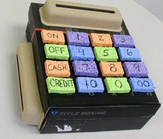 a small toy calculator made out of colored marshmallows with the words on it