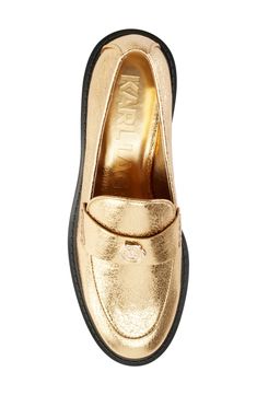 Elevate your everyday look with this prepster-classic loafer given eye-catching appeal by a shimmering golden finish. 1" heel Synthetic upper, lining and sole Imported Classic Gold Loafers With Round Toe, Classic Gold Slip-on Loafers, Gold Round Toe Loafers For Spring, Gold Slip-on Loafers With Round Toe, Gold Loafers With Round Toe For Spring, Classic Gold Loafers For Work, Classic Gold Loafers For Office, Classic Gold Flat Heel Loafers, Gold Slip-on Loafers For Office