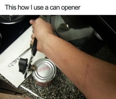 someone is cooking something on the stove with a can opener in front of him and his hand