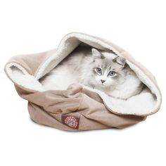 a cat is laying in a pet bed