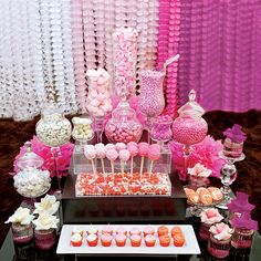 pink and white dessert table at a baby shower