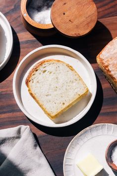 slices of bread and butter sit on plates