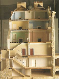 an architectural model of a house with stairs and balconies