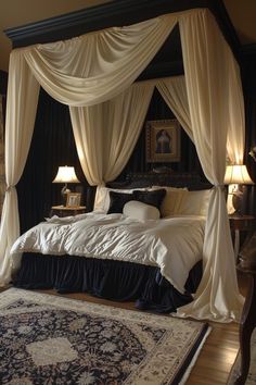 a large bed with white drapes and pillows on it's sides, in a bedroom