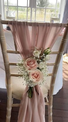 a chair decorated with pink and white flowers