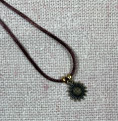 Sunflower statement charm necklace, add a touch of whimsy to your look and expresses your love of sunflowers. Makes a great gift, comes packaged ready to give. 24 inch brown cord necklace, knotted end, no clasp, metal  charm and brass beads matching bracelet also available Cute Handmade Brown Jewelry, Cute Adjustable Pendant Jewelry, Cute Adjustable Nickel-free Necklace, Brown Adjustable Jewelry As Gift, Flower Shaped Jewelry With Adjustable Cord As A Gift, Cute Adjustable Nickel-free Necklaces, Adjustable Flower Necklace Nickel Free, Brown Adjustable Jewelry Gift, Handmade Dainty Brown Jewelry