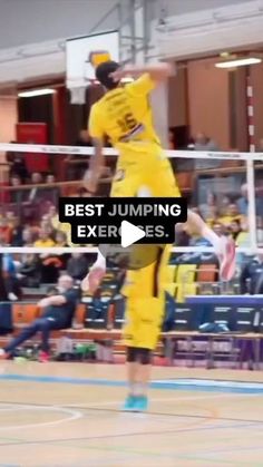 a person jumping up in the air to hit a ball with a volleyball racket