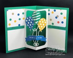 a handmade birthday card with balloons and polka dots on the front, in green