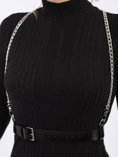 An elegant and alluring accessory, the Chain Suspender Harness features a sleek waist belt and chains that go straight over the shoulders. A sophisticated and versatile piece that adds a bold and stylish touch to any outfit. Perfect for those who embrace individuality and want to make a statement with their look, the harness can be paired with a form fitting dress for a sexy bold look or even with a blazer for an avant-garde style. Waist belt width: 3 cm Adjustable at the waist and shoulders Des Elegant Double Chain Belt For Evening, Edgy Black Chain Belt With Adjustable Chain, Edgy Chain Link Belt With Chain Strap, Edgy Chain Link Belt, Black Metal Waist Chain With Chain Strap, Edgy Black Adjustable Chain Belt, Chic Evening Chain Belt With Chain Strap, Trendy Chain Belt With Strap For Night Out, Chic Chain Belt For Evening