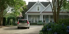 a car is parked in front of a house