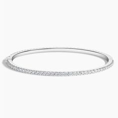 Luxe Whisper Lab Diamond Eternity Bangle Bracelet - 18K White Gold. This shimmering eternity bangle embellishes the wrist with glimmering lab grown diamonds for an elegant and stackable look (2 2/5 total carat weight). Dazzling Bangle With Pave Setting, Pave Set Cubic Zirconia Bangle, Cubic Zirconia Bangle With Pave Setting, Dazzling Diamond Bangle In White Gold, Dazzling Diamond Bangle Bracelet With Pave Setting, Dazzling White Gold Diamond Bangle, Dazzling Single Cut Diamond Bangle Bracelet, Fine Jewelry White Gold Diamond Bangle, Dazzling Diamond Bangle Bracelet