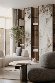 a modern living room with marble walls and furniture in neutral tones, including sofas