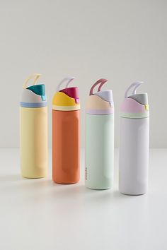 thermos are lined up in different colors