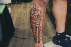 a person with a tattoo on their leg