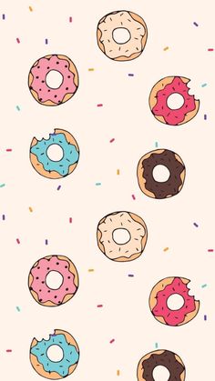 a bunch of donuts with sprinkles on them are flying in the air