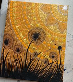 the painting is done with acrylic paint and has dandelions on it