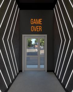 an entrance to a game over building with neon lights on the walls and door way