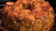 a bundt cake sitting on top of a pan covered in caramel glaze