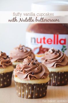 chocolate cupcakes with nutella buttercream frosting on a wooden table