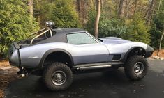 an off road vehicle parked in a parking lot