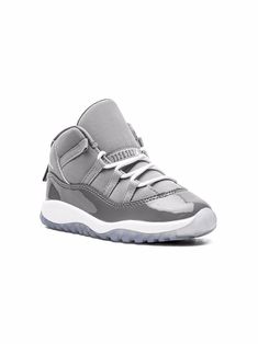 Grey patent leather Jordan 11 Retro sneakers from Jordan Kids featuring signature Jumpman motif, contrasting panel detail, round toe, front lace-up fastening, ankle-length, branded insole and rubber sole. These styles are supplied by a premium sneaker marketplace. Stocking only the most sought-after footwear, they source and curate some of the most hard to find sneakers from around the world.. | Jordan Kids Jordan 11 Retro sneakers Elyseen Jinwoo, Mom Dr, Accessories Packing, Jordan 11 Retro, Retro Sneakers