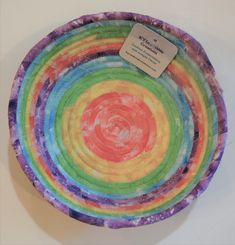 a multicolored paper plate with a label on it