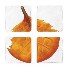 four square coasters with orange leaves on them