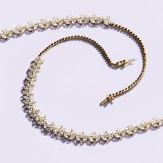 Embrace timeless elegance with the Alyssa Marquise Radiant Tennis Necklace. This exquisite piece features 23 dazzling diamond florets, each artfully arranged on a lustrous solid gold chain. Every floret is a masterpiece, crafted from four marquise-cut diamonds surrounding a brilliant round-cut diamond at the center, with each floret separated by a sparkling round-cut diamond for added brilliance. Whether you're walking down the aisle or attending a glamorous soirée, this statement diamond neckla Solid Gold Chains, Marquise Cut Diamond, Heart Shaped Diamond, Tennis Necklace, Two Hearts, Walking Down The Aisle, Rose Gold Necklace, Marquise Cut, Round Cut Diamond