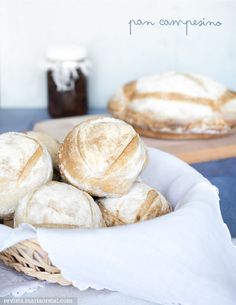 several loaves of bread sitting in a basket