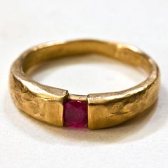 14k Solid Gold Textured Hammered set with 0.24carat natural Burmese ruby  14k 3.3gr. - ruby 0.24c - 980 dolarProduct description: Upper part width is- 4.5mm,lower part width - 2.5mm.ruby diameter - 3.8mmMetal 14k solid gold  weight 3.3 gr.You can also get this ring :You can get this ring also in 18k gold You can get this ring is Rose Pink and white goldYou can set this ring with other stones that suit your style and budget: Diamond, , Emerald, Blue sapphire, Amethyst, Citrine, Black Diamond, Red Gold Gem Jewelry, Handmade Gold Rings, Gold Ring Ruby, Modern Ruby Ring, Gold Ring Red Stone, Statement Gold Rings, Raw Ruby Ring, Hand Forged Round Ruby Rings, Unique Yellow Gold Ruby Promise Ring