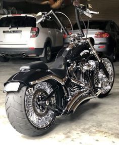 a black and silver motorcycle parked in a garage